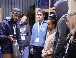 Mike Gretzinger, research coordinator at Farmer Smarter, spoke to students about the use of CO2 cannisters during orientation for summer students April 29.
